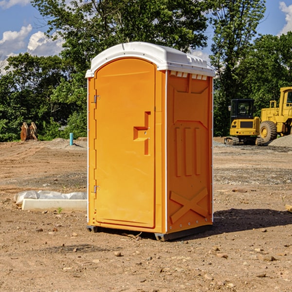 what is the cost difference between standard and deluxe portable restroom rentals in Clare IA